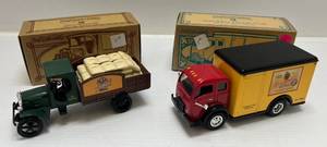 lot 164 image: Two Ertl Collectibles Die-Cast Metal Banks 1 1995  ( Leinenkugels ) 1925 Kenworth 1 1998 ( Leinenkugels ) 1949 White Tilt-Cab Truck