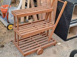lot 1065 image: Rolling Homemade Wooden Plant Stand