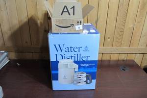 lot 4 image: Megahome Water Distiller White Enamel with Glass Carafe MH943TWS - Plus CleanerCharcoal