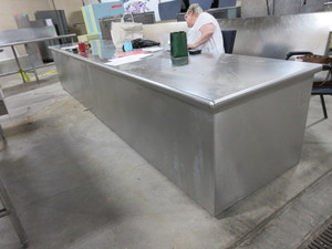 lot 239 image: STAINLESS STEEL COUNTER WITH BUILT IN STORAGE CABINET