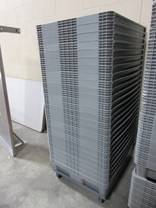 lot 255 image: ORBIS STACKABLE GREY TOTES ON WHEELED TRANSPORT DOLLY