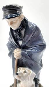 lot 66 image: Bing & Grndahl Danish Porcelain Figurine Man & Dog 727