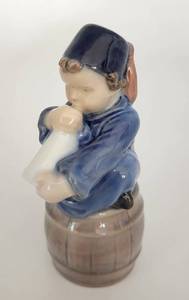 lot 77 image: Royal Copenhagen Danish Porcelain Boy with Horn 3689