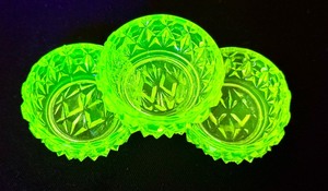 lot 143 image: Three Antique Uranium Glass Salt Cellars