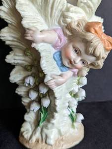 lot 31 image: Antique Porcelain Child and Lily of the Valley Vase