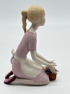 lot 79 image: Vintage Cybis Bisque Girl with Plant