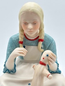 lot 62 image: Cybis Figurine Elizabeth Ann with Raggedy Ann Doll