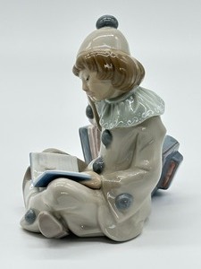 lot 19 image: Lladro Clown Girl with Accordion Porcelain Figurine