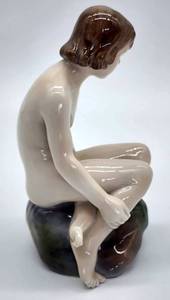 lot 328 image: Royal Copenhagen Girl on Rock Porcelain Figurine, Number 4027