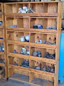 lot 371 image: Wooden Parts Organizer Cabinet 48x12-12x76 with Pipe Fittings