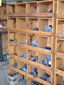 lot 372 image: Wooden Parts Organizer Cabinet 48x12-12x76 with Pipe Fittings