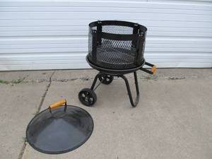 lot 341 image: Unused Outdoor Rolling Metal Fire Pit