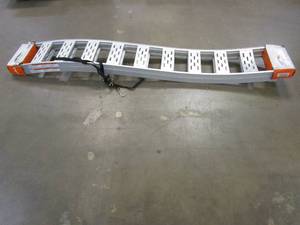 lot 100 image: CargoSmart 12 in. W x 90 in. L 1500 lb. Capacity Aluminum Fixed S-Curve Truck Loading Ramp with Treads (Includes 2 Ramps) (ONE TREAD IS BENT)
