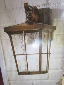 lot 131 image: Home Decorators Collection Barrington 1-Light Golden Bronze Outdoor 14 in. Wall Lantern Sconce with Clear Water Glass (OPEN BOX)