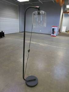 lot 150 image: Hampton Bay 62 .5 in. Black Cline Floor Lamp with Clear Glass Shade (OUT OF BOX)