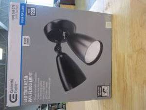 lot 217 image: Exclusive Commercial Electric Twin-Head Directional Bronze Outdoor Integrated LED Flood Light for Outdoor Security Lighting with Photocell (OPEN BOX)