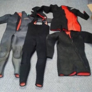 lot 157 image: Wet suits. unknown SIZES.
