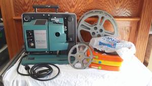 lot 258 image: Vintage Bell And  Howell Projector And Film.