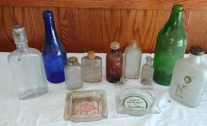 lot 268 image: Vintage Bottles (24) And Ash Trays(2)