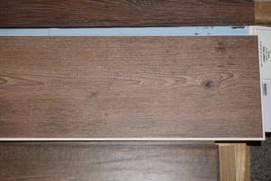 lot 142 image: (1 Box) 7 x 48 Plank Flooring by Revolution