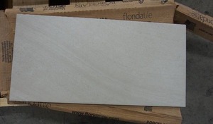 lot 185 image: (1 Box) 12 x 24 Porto Cream Porcelain Tile by FloridaTile