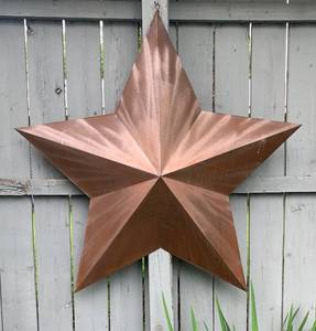 lot 26 image: Large Rust Colored Metal Star