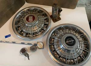 lot 33 image: Car stuff, 2 hubcaps, And 500 Emblem