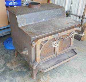 lot 2 image: Radiant wood stove - well made, heavy wall, little use