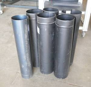 lot 22 image: Six pieces of black stove pipe 24 inches long x 6 inch diameter, plus the L that went outside