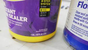 lot 111 image: Gallon of ZEP floor sealer (the blue jug doesnt have much in it)
