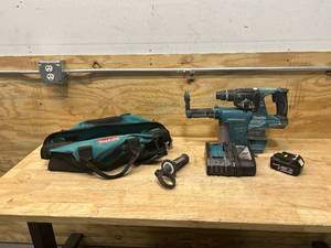 lot 49 image: MAKITA Hammer Drill with HEPA Filter, Charger, Battery and Carrying Bag