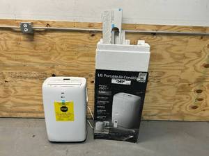 lot 28 image: LG 6,000 BTU (DOE) 115-Volt Portable Air Conditioner LP0621WSR Cools 250 Sq. Ft. with Dehumidifier Function and LCD Remote