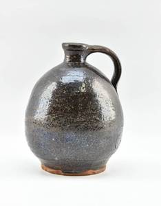 lot 157 image: Dark Brown Antique Redware Jug