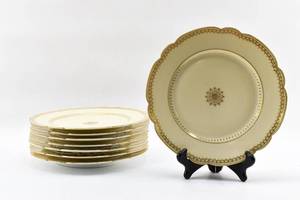 lot 196 image: Set of Eight Cream and Gold Dinner Plates