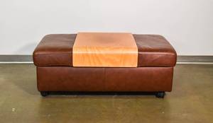 lot 134 image: Rolling Leather Ottoman with Wooden Top by Ekornes