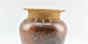 lot 444 image: Indonesian Pottery Vessel with Woven Rim