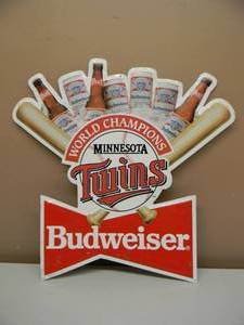 lot 96 image: BUDWEISER BEER MINNESOTA TWINS WORLD CHAMPIONS EMBOSSED METAL  TIN BAR SIGN - FANTASTIC PIECE - APPROX 23 By 23 - SEE PICTURES