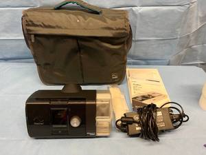 lot 7 image: Like New MSRP $1800 ResMed AirSense 10 AutoSet & HumidAir CPAP Machine WCarry Bag, Power Cord, New In Package Strap - No Hose & Mask -Great Working Condition&nbspWOW Only 1997 Hours On This Fantastic Machine