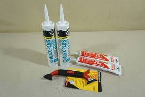 lot 124 image: Assorted Caulk with Caulking Tool