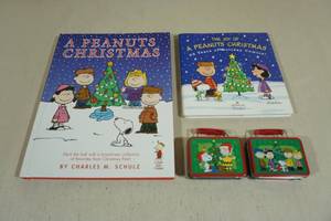 lot 234 image: Peanuts Christmas Books and Tins