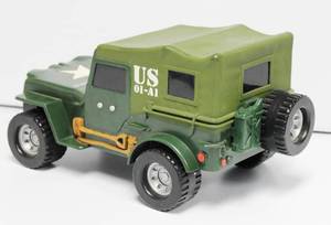 lot 75 image: General Barker Vintage Army Jeep 11 Inch Long Lights Up And Moves Its Mouth