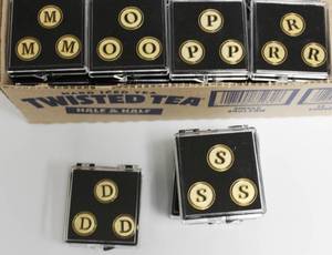 lot 82 image: Box Of Assorted Letter Golf Ball Markers 52 Packs Total Count