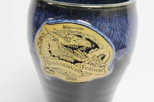 lot 88 image: 1999 Minnesota Renaissance Festival Beer Stein 7 34 Long, Made In New London Pottery, MN