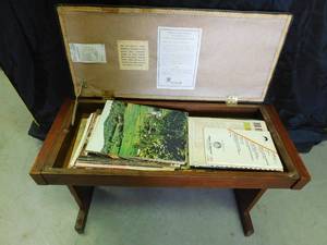 lot 50 image: Organ bench full of music books