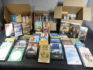 lot 90 image: 3 boxes of DVDs and VHS tapes