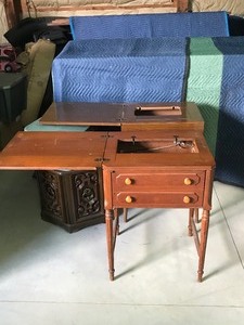 lot 310 image: 2 vintage sewing machine cabinets,vintage suitcase of material and an octagon end table