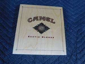 lot 209 image: Camel wood box of tins