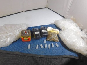 lot 239 image: 2 carrying cases, loading tubes, 12 gauge shotgun wads, rifle powder can