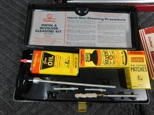 lot 244 image: shotgun and pistol cleaning kits and Western hand trap