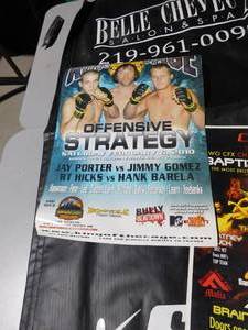 lot 498 image: Brainerd fight banners and posters, shorts, exercising bar, and 2 liquor bqnners